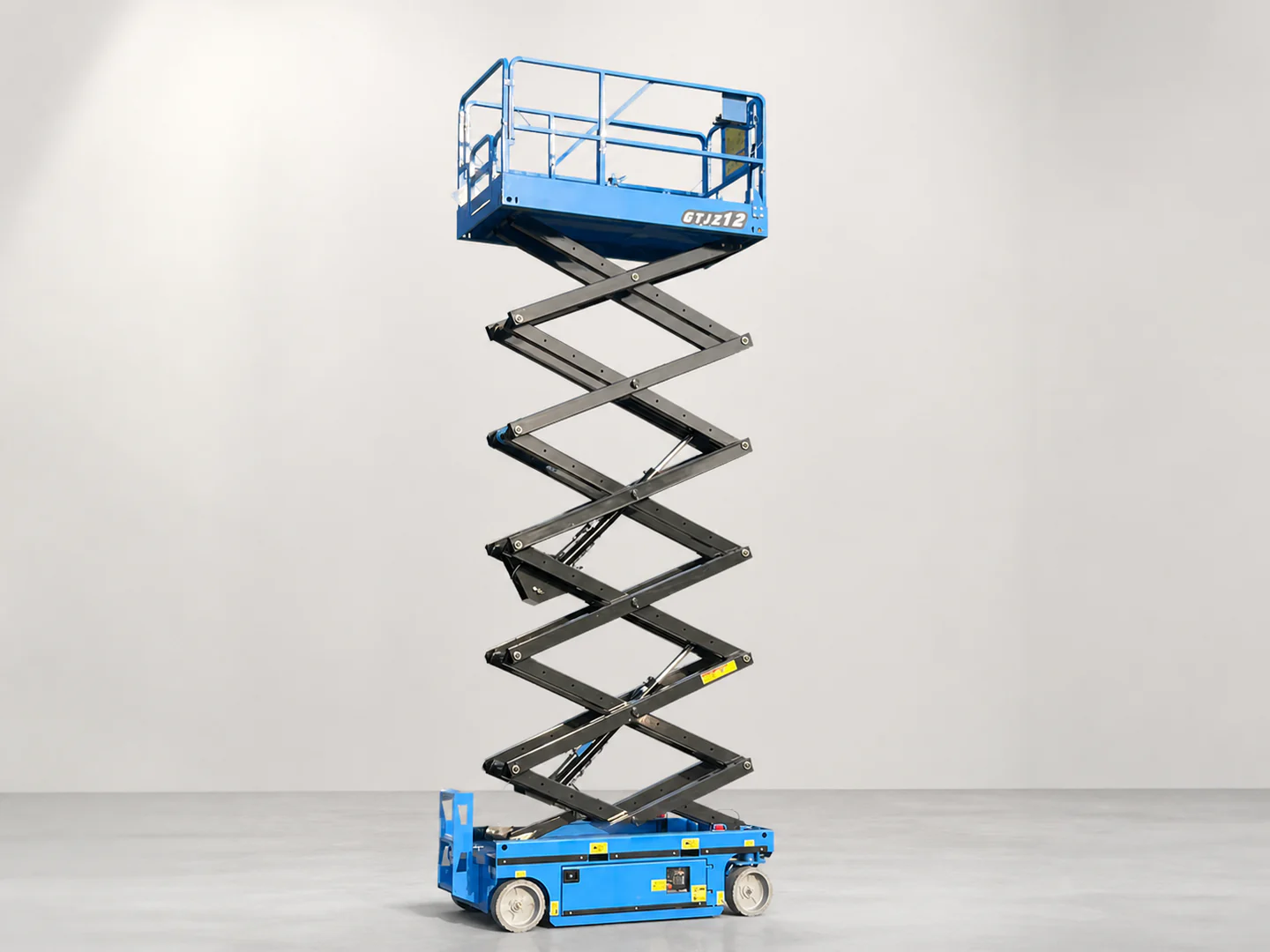 Blue scissor lift shown in a raised position