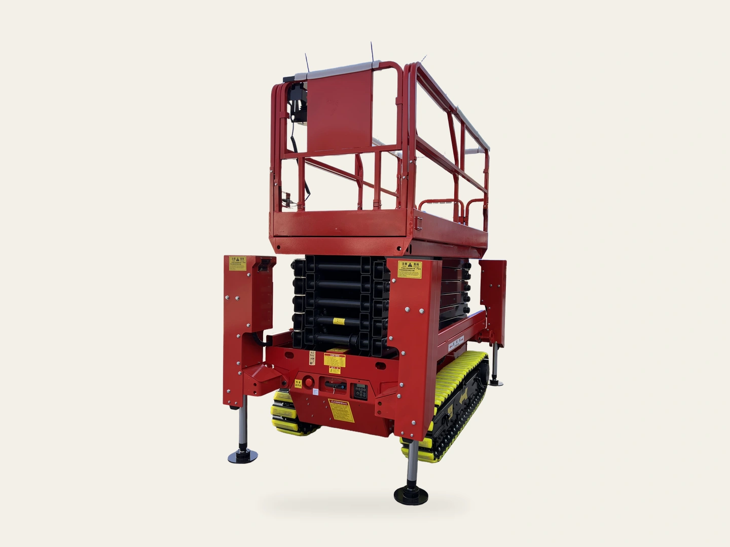 Complete red crawler scissor lift with folded scissors, yellow tracks and stabilizers in a three-quarter view