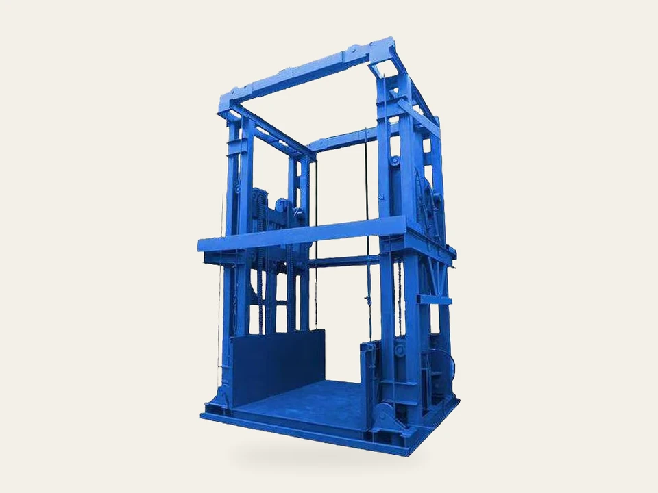 Complete blue guide rail freight lift with its base platform in a three-quarter view