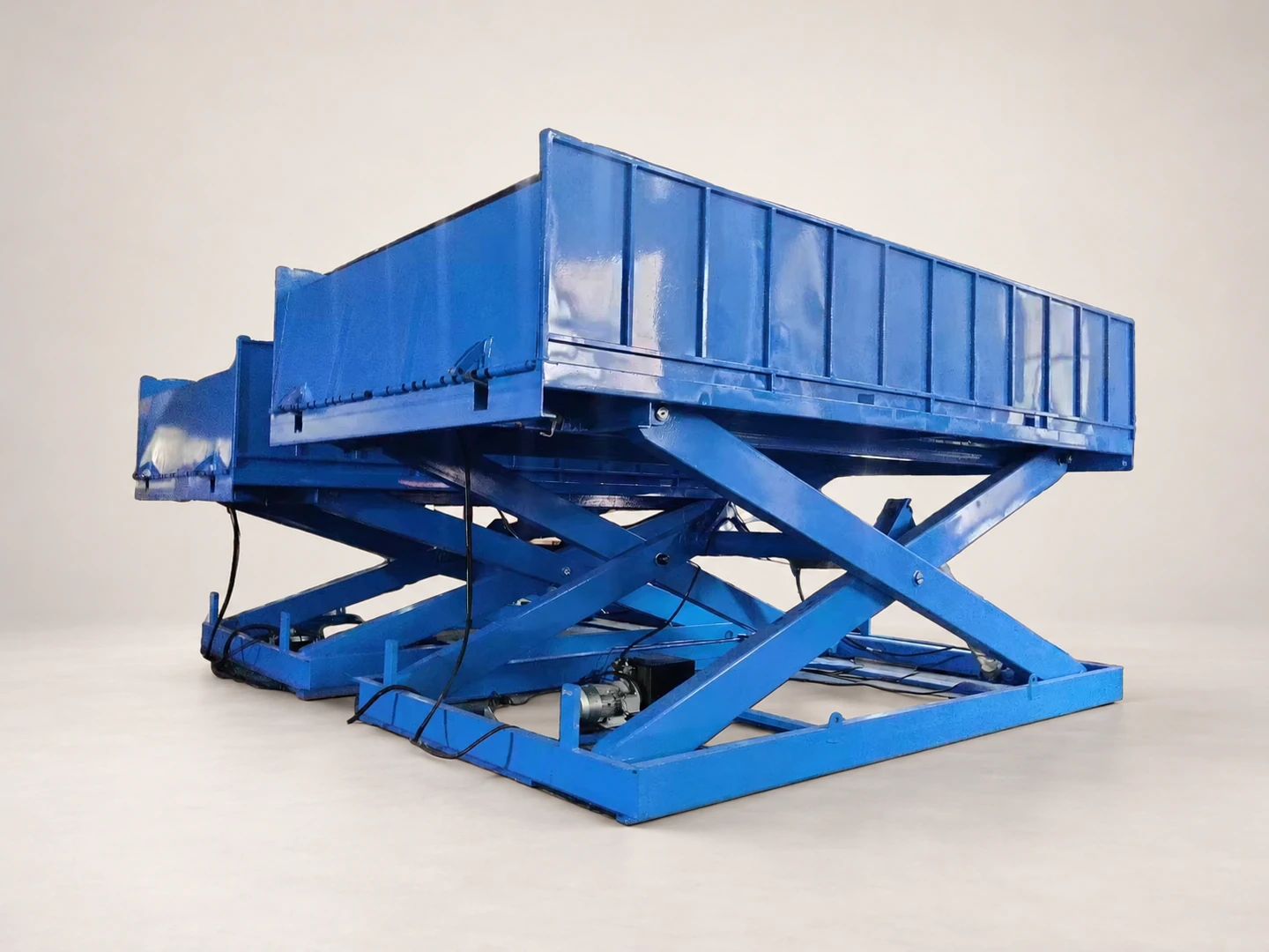 Complete blue fixed scissor lift table showing its platform, scissors and base